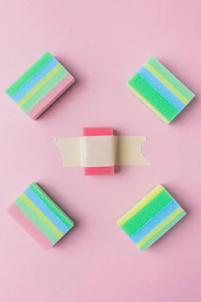 Top view of colorful washing sponges, isolated on pink — Stock Photo