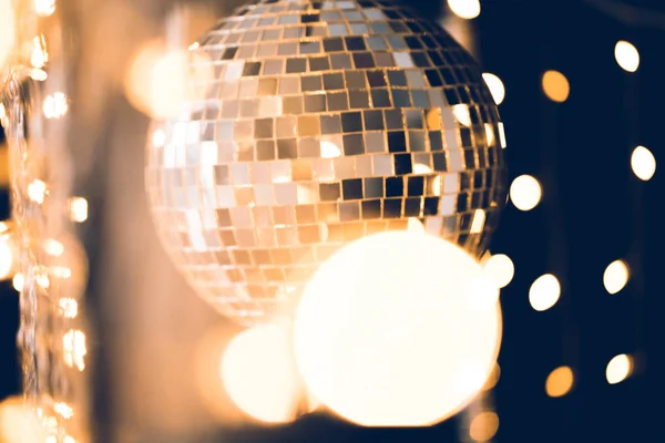 Classic disco ball with christmas lights around — Stock Photo