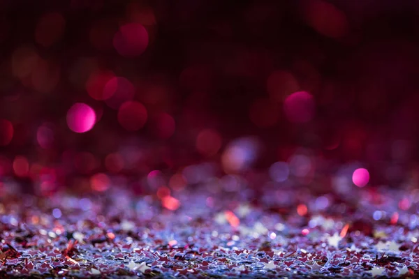 Christmas background with pink and silver shiny confetti stars — Stock Photo