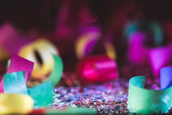 Christmas confetti and shiny stars with blurred background — Stock Photo
