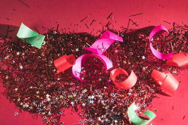 Big christmas confetti and sparkles on pink background — Stock Photo