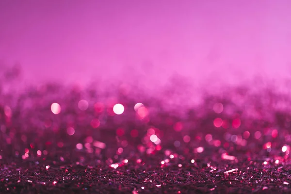 Fondo de Navidad con confeti brillante rosa y púrpura — Stock Photo