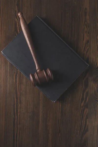 Juridical book with hammer on wooden table, law concept — Stock Photo