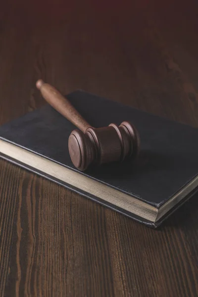 Juridical book with hammer on wooden table, law concept — Stock Photo