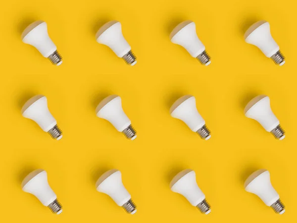 Full frame of arrangement of light bulbs isolated on yellow — Stock Photo