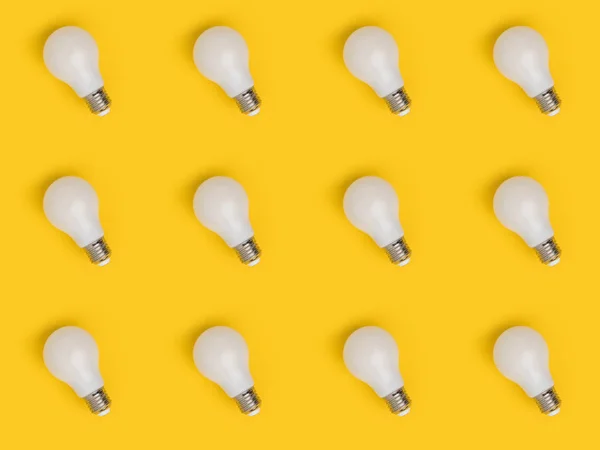 Full frame of arrangement of light bulbs isolated on yellow — Stock Photo