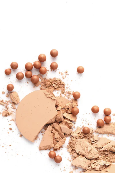 Crushed nude cosmetic powder isolated on white — Stock Photo