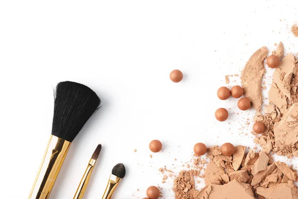 Crushed nude cosmetic powder isolated on white — Stock Photo