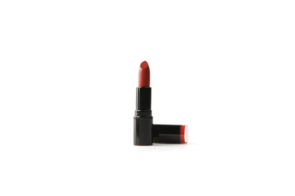 Single tube of burgundy color lipstick isolated on white — Stock Photo