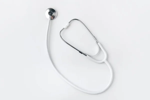 Stethoscope laying isolated on white background — Stock Photo