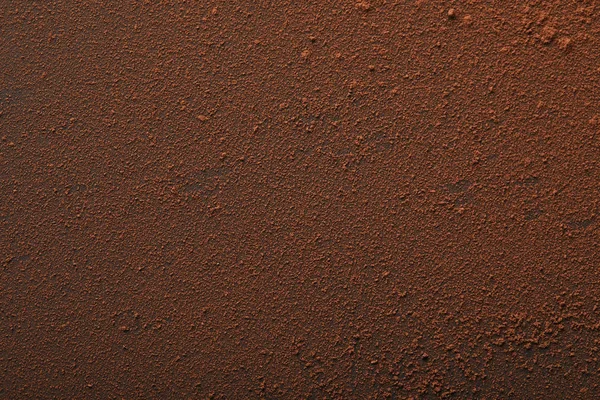 Marco completo de sabroso cacao en polvo en la superficie - foto de stock