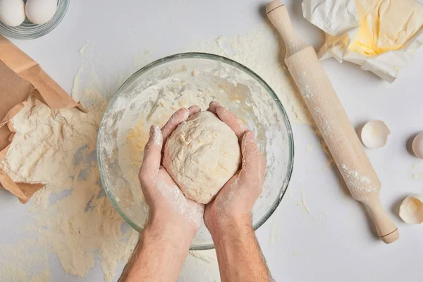 Cropped image of chef holding dough in hands — Stock Photo