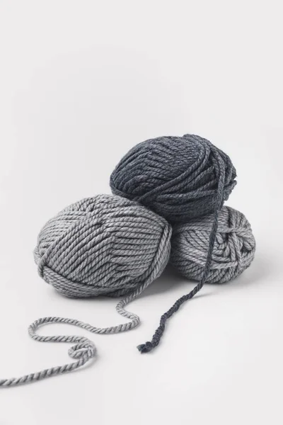 Three grey yarn balls isolated on white — Stock Photo