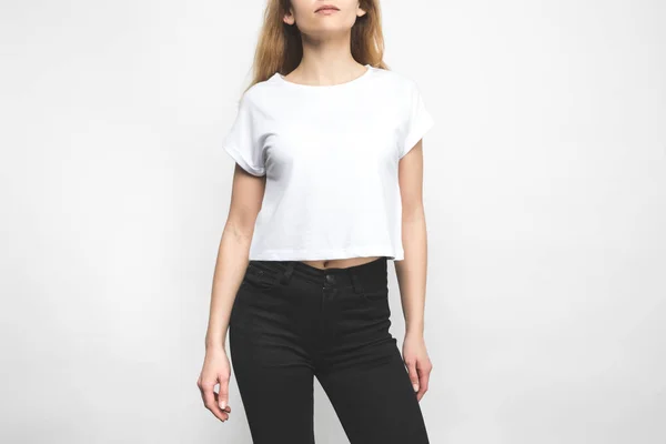 Attractive young woman in blank t-shirt on white — Stock Photo