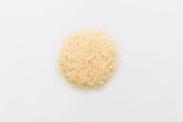 Top view of heap of raw rice isolated on white — Stock Photo