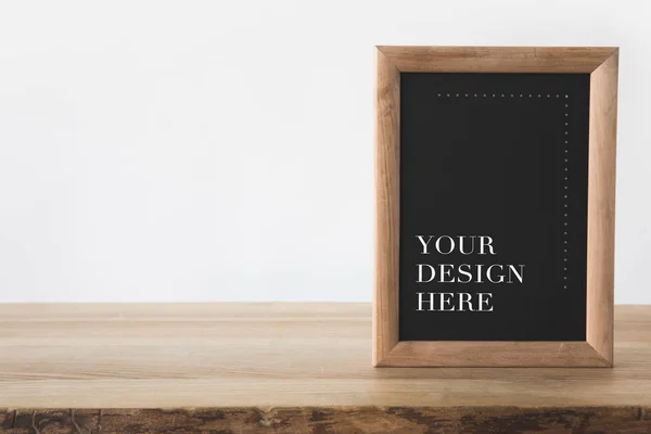Blackboard in frame with text your design here on white — Stock Photo