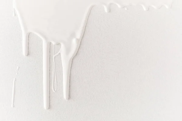 White dripping paint on white surface — Stock Photo