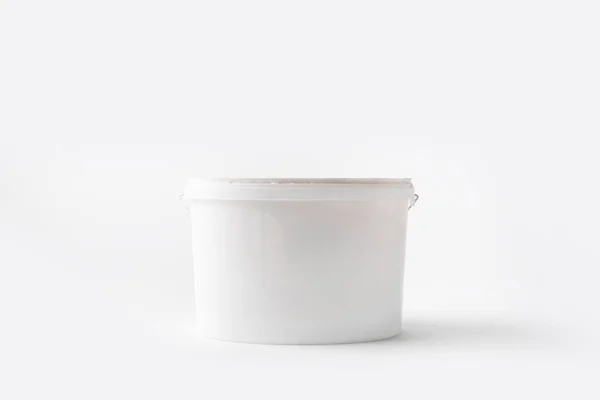 One plastic bucket with paint isolated on white — Stock Photo