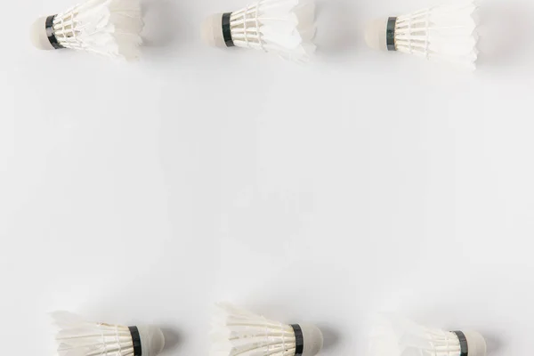 Top view of frame made of badminton shuttlecocks on white surface — Stock Photo