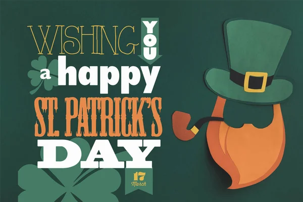 Close up view of paper made green hat and beard with wishing you a happy st patricks day lettering on green background — Stock Photo