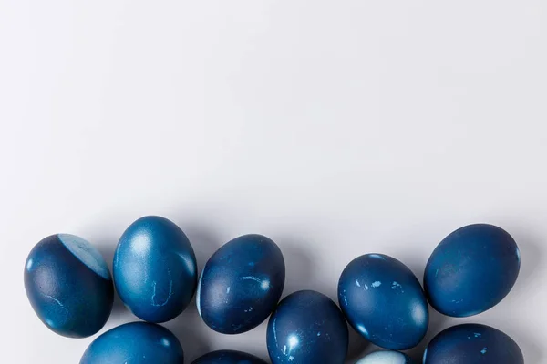 Top view of blue painted easter eggs on white — Stock Photo