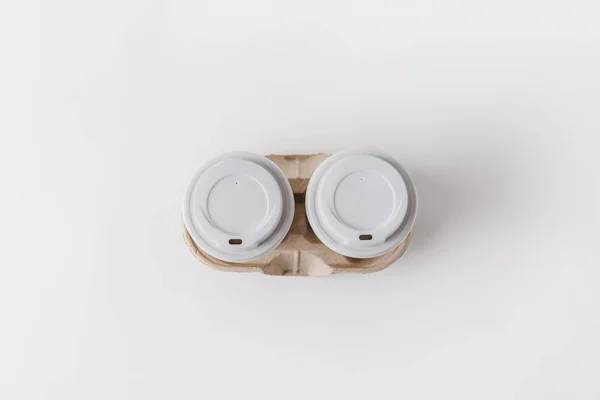 Top view of coffee in paper cups in cardboard tray on tabletop — Stock Photo