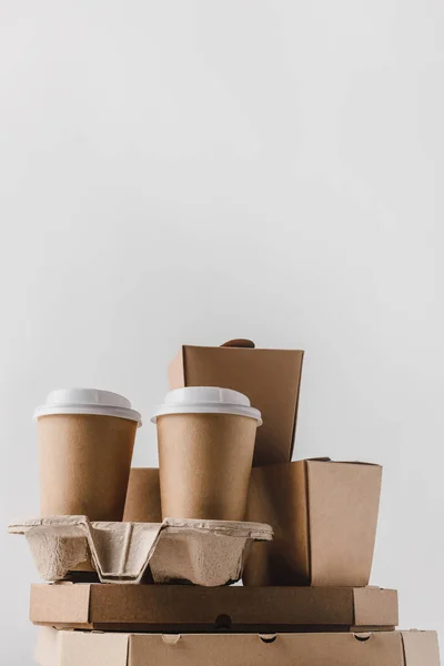Pizza boxes and disposable coffee cups isolated on white — Stock Photo