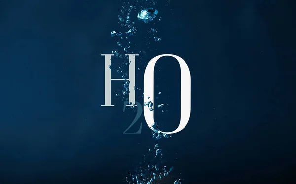 H2o chemistry symbol and bubbles in water background — Stock Photo