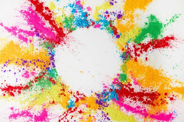 Circle frame of multicolored traditional powder, isolated on white, holi festival — Stock Photo