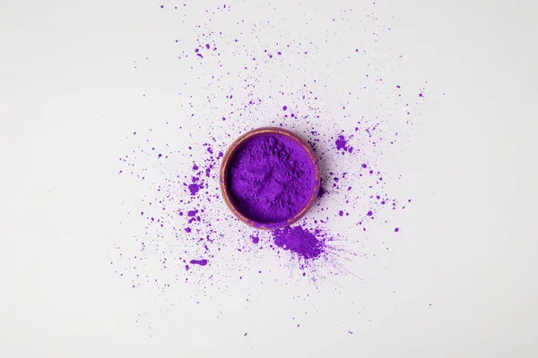 Top view of purple holi paint in bowl isolated on white, festival of colours — Stock Photo