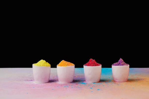 Traditional holi paint in bowls on white, Hindu spring festival — Stock Photo