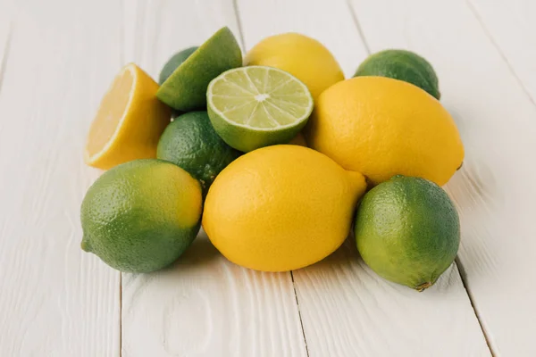 Juicy citruses on white wooden background — Stock Photo