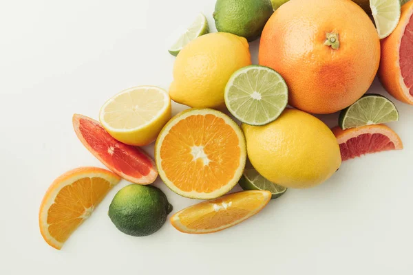 Assorted juicy citruses isolated on white background — Stock Photo