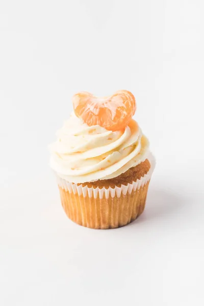 Close up view of sweet cupcake with cream and tangerine isolated on white — Stock Photo