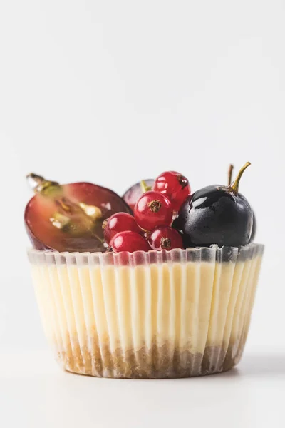 Close up view of sweet cupcake with berries and fruits isolated on white — Stock Photo