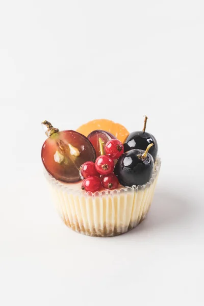 Close up view of sweet cupcake with berries and fruits isolated on white — Stock Photo