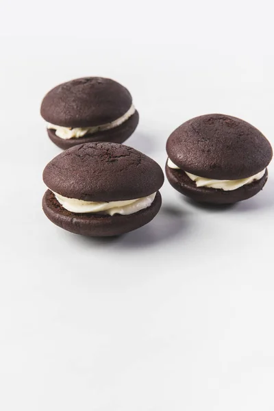 Close up view of chocolate cookies with cream isolated on white — Stock Photo
