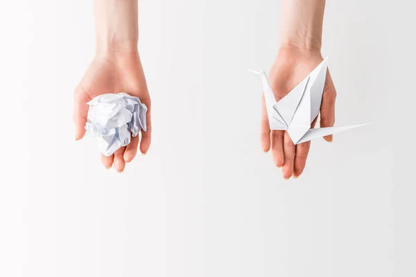 Cropped shot of woman holding ball and bird made of paper in hands isolated on grey, environment and recycling concept — Stock Photo