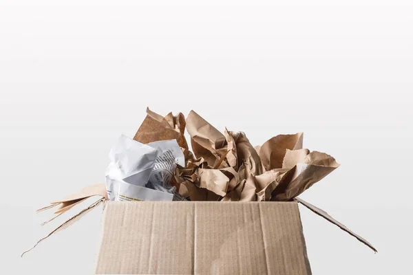 Close up view of cardboard box with papers inside isolated on white — Stock Photo