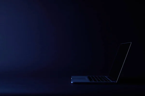 One turned off open laptop on dark — Stock Photo