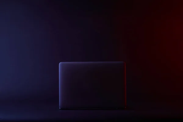 One turned off laptop on dark surface — Stock Photo