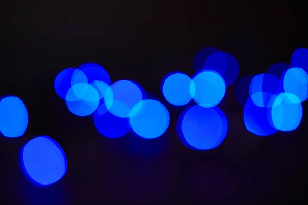 Abstrato azul escuro brilhando fundo bokeh — Fotografia de Stock