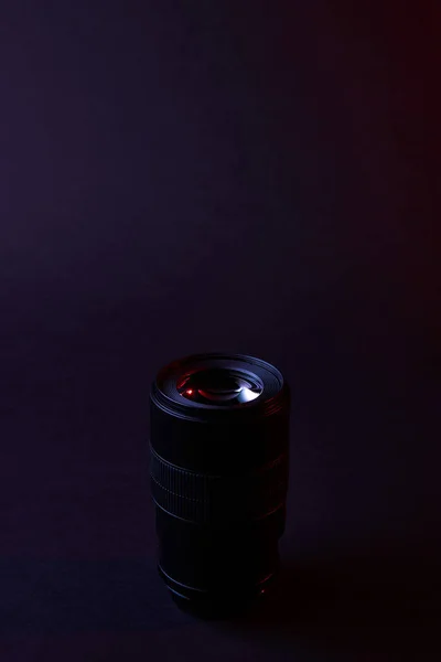 One photographic objective on dark surface — Stock Photo