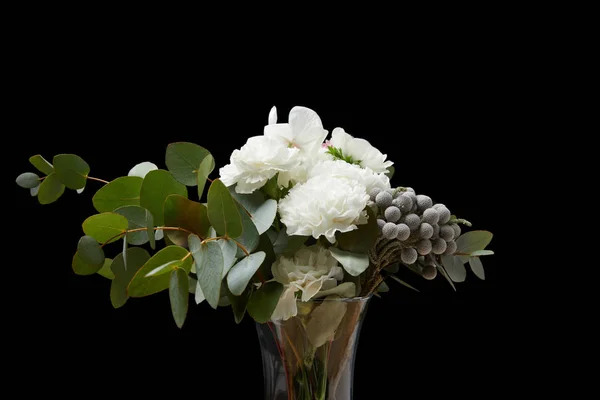 Tender flowers in vase isolated on black — Stock Photo