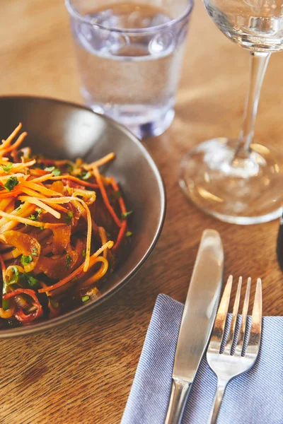 Hot delicious udon dish with pork on restaurant table — Stock Photo