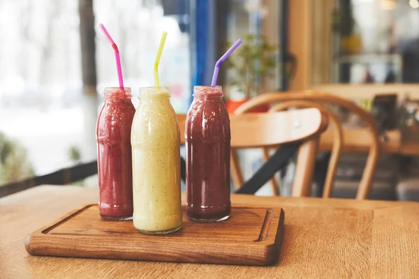 Healthy meal with fruit smoothies on table — Stock Photo