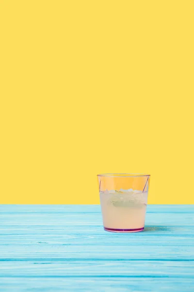 Fresh cold summer cocktail on turquoise wooden table top — Stock Photo