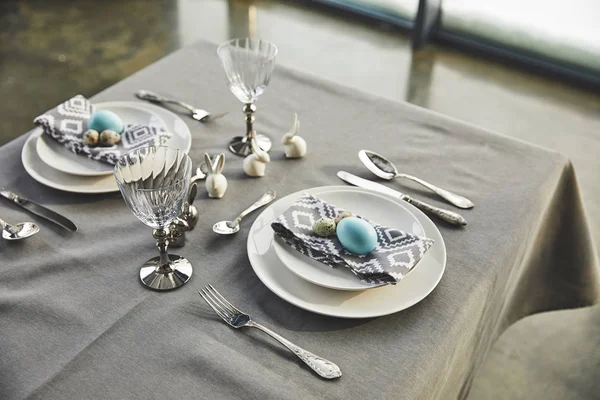 High angle view of chicken and quail easter eggs on plates — Stock Photo