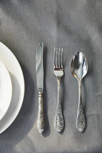 Top view of utensil on grey tablecloth — Stock Photo