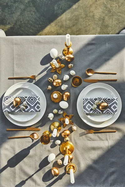 Top view of easter eggs and candles on festive table in restaurant — Stock Photo